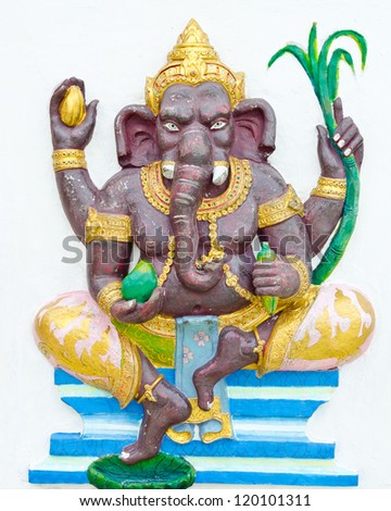 God of success 1 of 32 posture. Indian style or Hindu God Ganesha avatar image in stucco low relief technique with vivid color,Wat Samarn, Chachoengsao,Thailand.