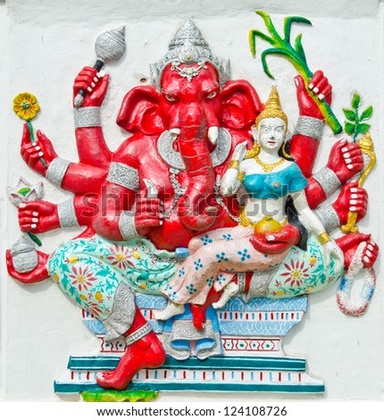 God of success 25 of 32 posture. Indian style or Hindu God Ganesha avatar image in stucco low relief technique with vivid color,Wat Samarn, Chachoengsao,Thailand.
