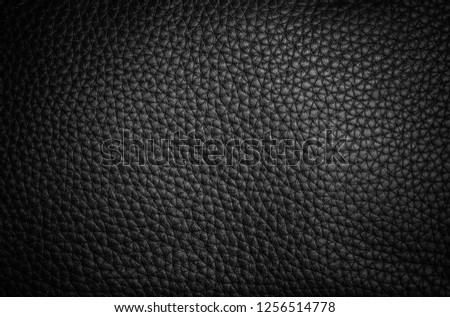 background and texture of real black leather sheet on bag leather
