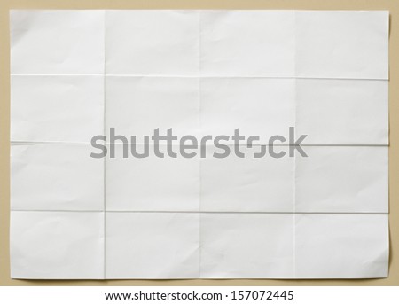 Background Of White Textured Sheet Of Paper Folded In Sixteen Part For Write