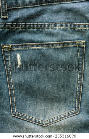 jeans background with trendy broken fabric texture and pocket