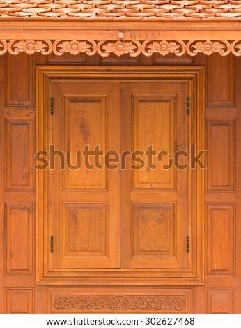 close up wood Casement Window on wall house Thai style background