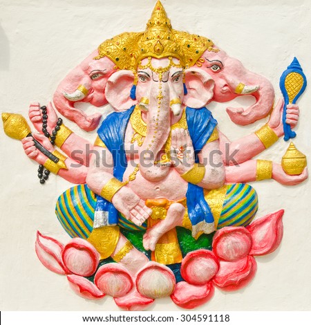 God of success 29 of 32 posture. Indian style or Hindu God Ganesha avatar image in stucco low relief technique with vivid color,Wat Samarn, Chachoengsao,Thailand.