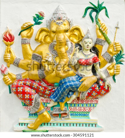 God of success 30 of 32 posture. Indian style or Hindu God Ganesha avatar image in stucco low relief technique with vivid color,Wat Samarn, Chachoengsao,Thailand.