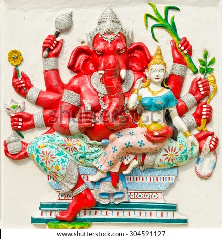 God of success 25 of 32 posture. Indian style or Hindu God Ganesha avatar image in stucco low relief technique with vivid color,Wat Samarn, Chachoengsao,Thailand.