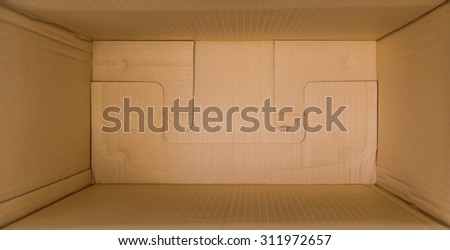 close up packed or hidden inside a cardboard packaging box