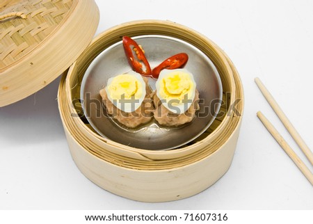 Chinese steamed dimsum egg in bamboo containers traditional cuisine