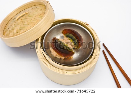 Chinese steamed dimsum preserved egg in bamboo containers traditional cuisine