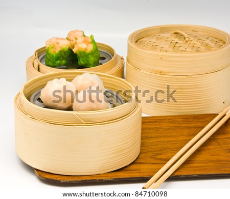 Chinese steamed dimsum in bamboo containers traditional cuisine