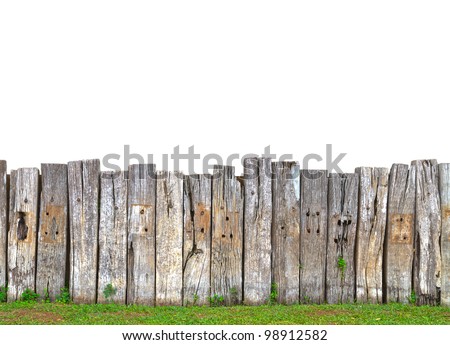 old wooden fence in garden with grass