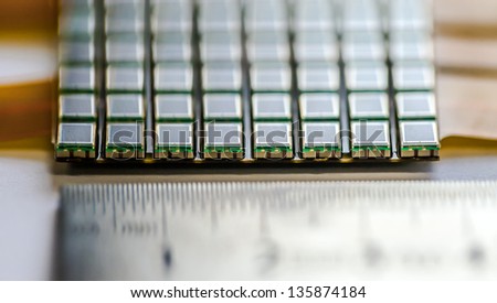 Grid of photo-multipliers sensors with ruler. Tiny part of iTOP -  a new type of Cherenkov detector for Belle experiment (Tsukuba, Ibaraki Prefecture, Japan).