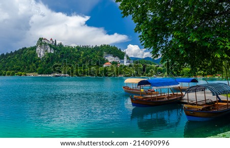 Boats at the pier that help one to trip to the island in the middle of the Bled lake and ringing the bell of the 17th century church. Slovenia.