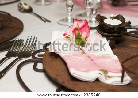 Wedding Table setting with rusted colors and pink flowers