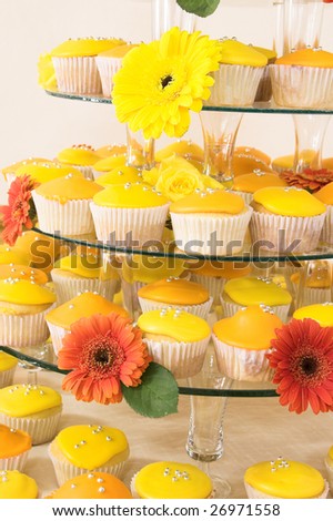 stock photo Yellow cupcakes on a stand for wedding