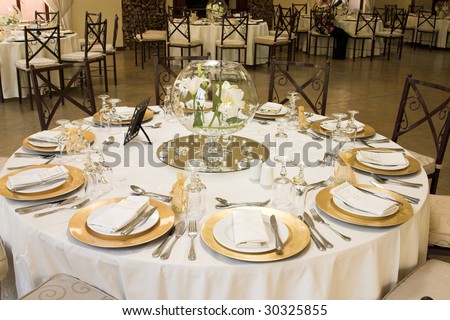 stock photo Wedding Table setting with golden coloured plates