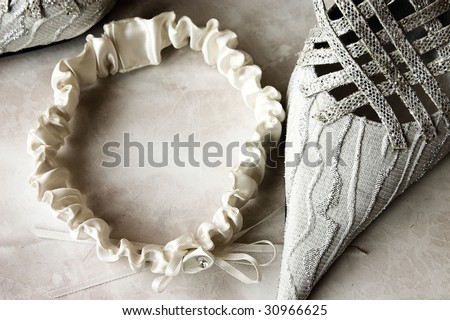 Toned image of wedding garter and shoe