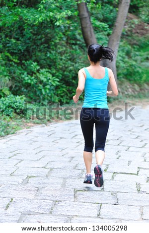 young asian woman jogging