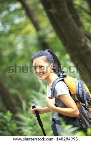 young asian woman hiker in jungle