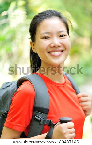 happy woman hiker in jungle