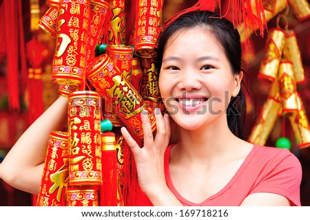 young woman wishing a happy chinese new year