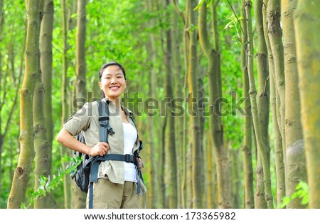 young woman hiker in tropical jungle