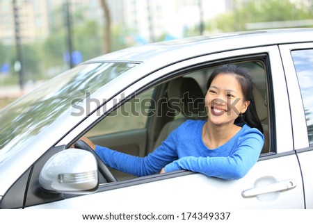 happy woman driver sit in car