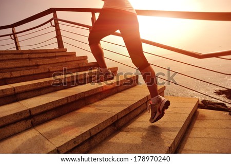 healthy lifestyle sports woman running on stone stairs seaside healthy lifestyle sports woman running on stone stairs seaside
