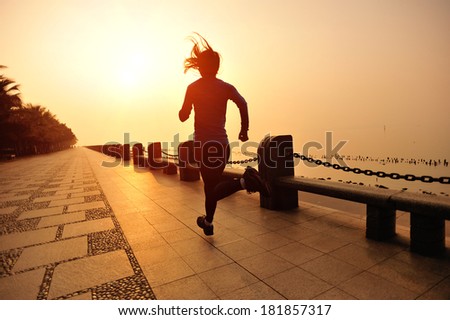healthy lifestyle fitness woman running at seaside under sunrise healthy lifestyle fitness woman running at seaside under sunrise