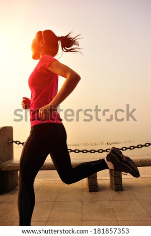 healthy lifestyle fitness woman running at seaside under sunrise healthy lifestyle fitness woman running at seaside under sunrise