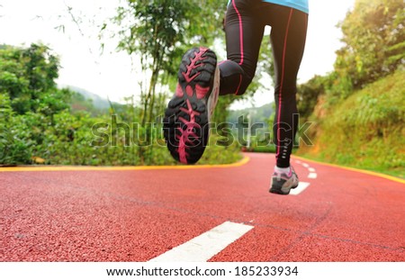 healthy lifestyle fitness sports woman running at park trail