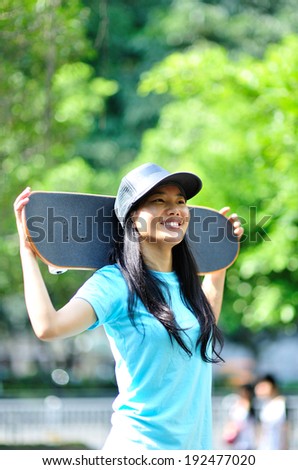 skateboarding woman at skateboard park