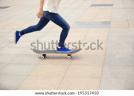 speeding skateboarding woman at city
