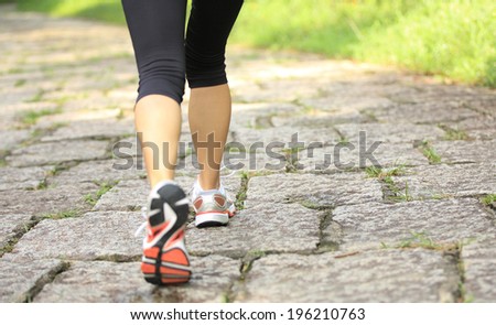 hiking woman on forest trail