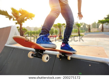 skateboarding woman at sunrise skatepark