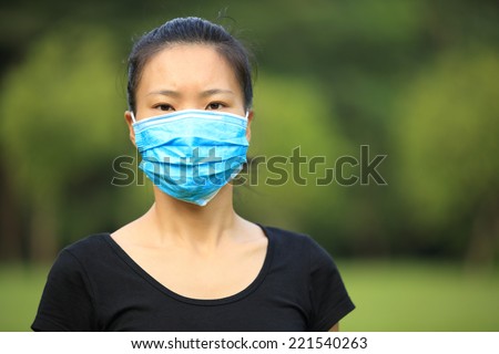 asian woman wear face mask outdoor
