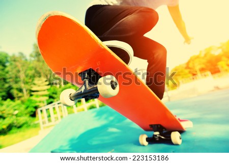 skateboarding woman legs at skatepark
