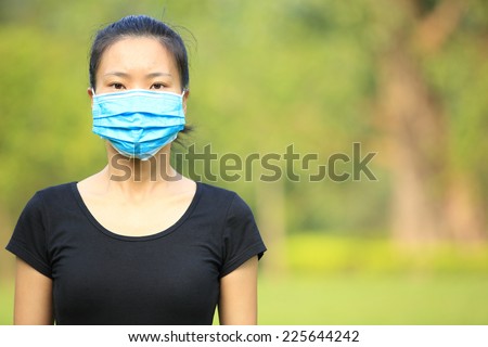 asian acne girl wear face mask outdoor