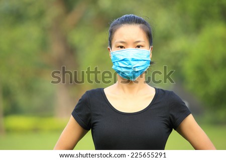 asian woman wear face mask outdoor