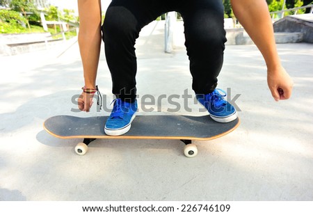 woman skateboarder skateboarding at skatepark