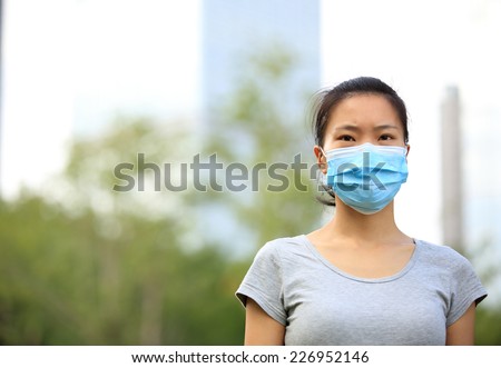 asian woman wear face mask in city