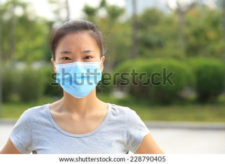 asian woman wear face mask in city