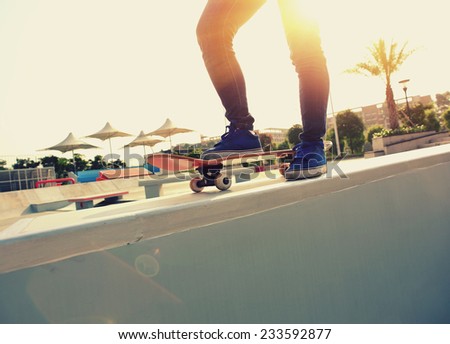 skateboarding woman legs
