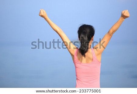 cheering woman on beach
