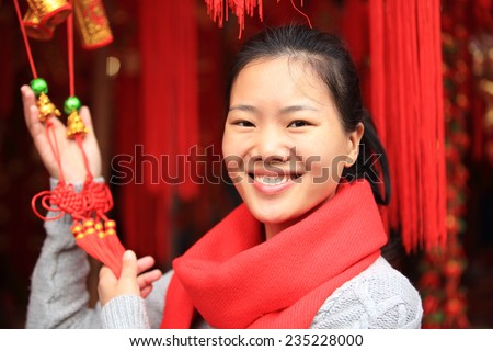 young asian woman hold red chinese knot wishing you a happy chinese new year