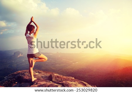 yoga woman mountain peak