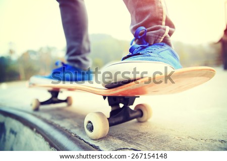 skateboarding legs at skate park