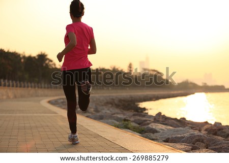 fitness woman running at seaside. woman fitness silhouette sunrise jogging workout wellness concept.