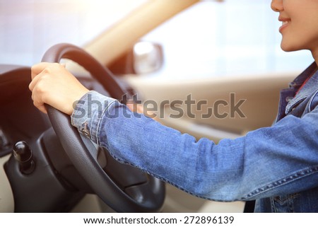 beautiful young asian woman driver driving car