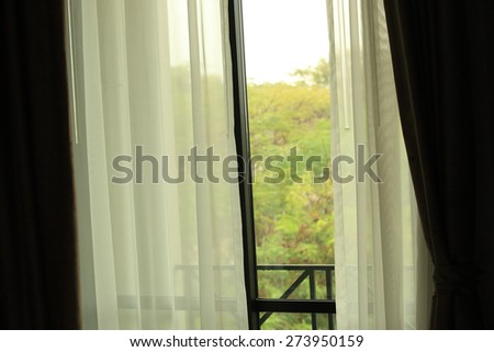 open curtain of bedroom window