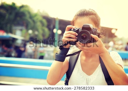 woman tourist taking photo at Damonen saduak floating market